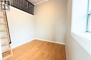 Hamilton apartment for rent - A room with wooden flooring and a ladder against the wall.