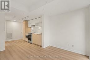 Toronto (Church-Yonge Corridor) condo for rent - A spacious kitchen with wooden floors and white walls.