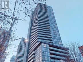 Toronto (Mount Pleasant West) condo for rent - A tall glass building with the words CENTRAL BROKERAGE on the side.
