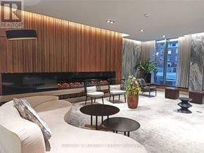 Toronto (Mount Pleasant West) condo for rent - A living room with a fireplace and a couch.