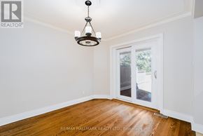 Toronto (Birchcliffe-Cliffside) apartment for rent - A room with a wooden floor and a chandelier hanging from the ceiling.