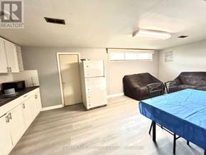 Toronto (Woburn) apartment for rent - A living room with a couch, chair, and table.
