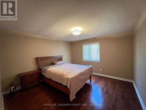 Richmond Hill (Bayview Hill) apartment for rent - A bedroom with a bed, nightstand, and window.