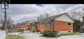 Burlington (Freeman) apartment for rent - A house with a snow-covered ground and a cloudy sky in the background.