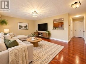 Burlington (Freeman) apartment for rent - A living room with a couch, coffee table, and a television.