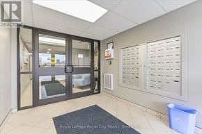 Centre Wellington (Fergus) condo for rent - A foyer with a Royal LePage Realty logo on the wall.