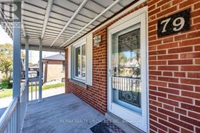 Toronto (Rexdale-Kipling) apartment for rent - A house number 79 with a white door and window.