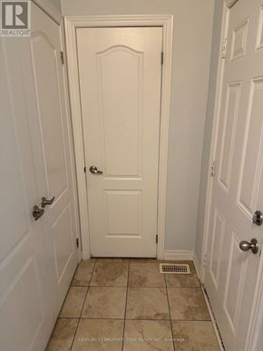 Brampton (Credit Valley) apartment for rent - A white door with a handle and a small square window in the center.