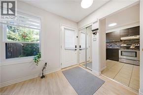 Kitchener townhouse for rent - A realtor photo of a kitchen with a dining area.