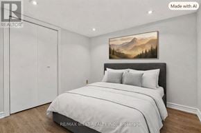 Toronto (Little Portugal) townhouse for rent - A bedroom with a large bed and a mountain painting on the wall.