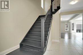 Waterloo apartment for rent - A staircase in a house with a brochure in the background.