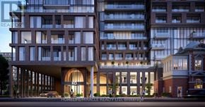 Toronto (South Parkdale) condo for rent - A modern building with a large entrance and balconies is shown in the image.