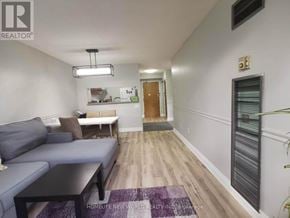Toronto (Morningside) condo for rent - A living room with a grey couch and a black coffee table.