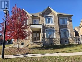 Newmarket (Stonehaven-Wyndham) apartment for rent - A house with a red tree in front of it.