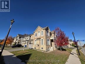 Newmarket (Stonehaven-Wyndham) apartment for rent - A house with a sign that says Goldenway Real Estate Ltd.