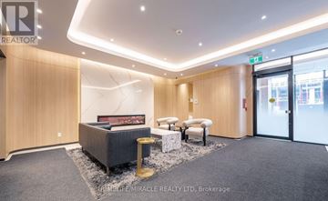 Toronto (Oakwood Village) condo for rent - A well-lit, modern waiting area with a sofa, armchairs, and a coffee table.
