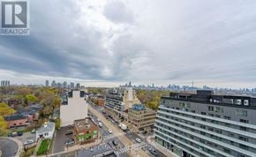 Toronto (Oakwood Village) condo for rent - A cityscape with buildings and a cloudy sky.
