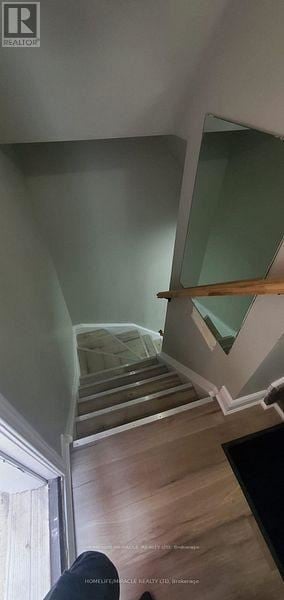 Brampton (Bram East) apartment for rent - A white door is in a room with light wood flooring.