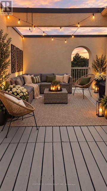 Brampton (Westgate) townhouse for rent - A cozy outdoor seating area with a couch, chairs, and string lights.
