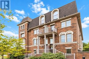 Brampton (Westgate) townhouse for rent - A large brick house with a balcony and multiple windows.