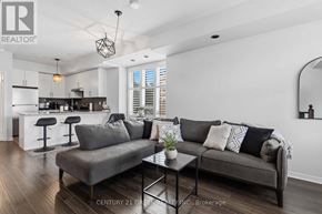 Brampton (Westgate) townhouse for rent - A modern living room with a grey sofa and a coffee table.