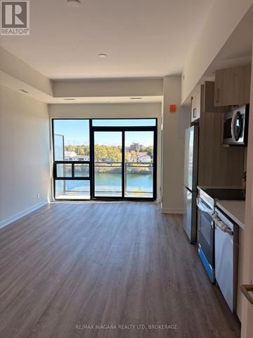 Welland (Broadway) condo for rent - A spacious kitchen with a view of the water through the windows.