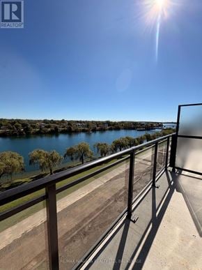 Welland (Broadway) condo for rent - A sunny day with a clear blue sky and a body of water in the distance.