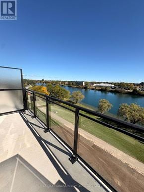 Welland (Broadway) condo for rent - A balcony with a view of a lake and trees.