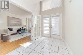 Brampton (Sandringham-Wellington) apartment for rent - A living room with a couch, chair, and a painting on the wall.