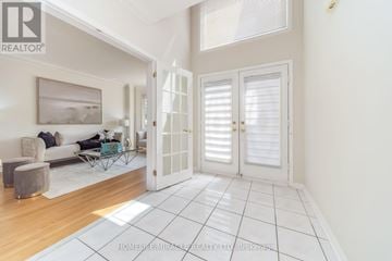 Brampton (Sandringham-Wellington) apartment for rent - A living room with a couch, chair, and a painting on the wall.