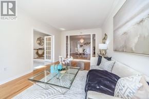 Brampton (Sandringham-Wellington) apartment for rent - A modern bedroom with a glass coffee table and a large bed.