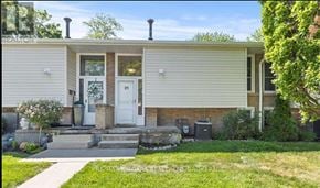 St. Catharines (Vine/Linwell) townhouse for rent - A house with a white door and a small porch.