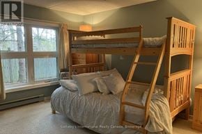 Collingwood townhouse for rent - A bedroom with a bunk bed and a window.