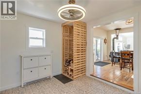 Upper Cape apartment for rent - A room with a white dresser and a wooden slat wall.