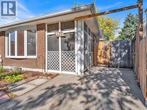 Windsor apartment for rent - A house with the number 9832 on the window.
