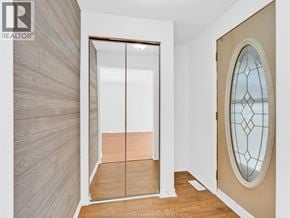 Windsor apartment for rent - A room with a sliding door and a stained glass window.