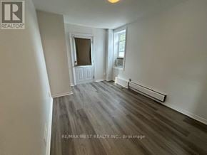 Toronto (Weston-Pellam Park) apartment for rent - A room with a window and a door in it.