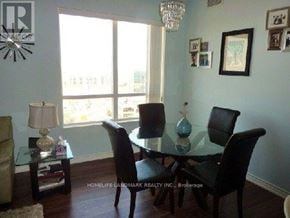 Toronto (Banbury-Don Mills) condo for rent - A dining room with a glass table and chairs.
