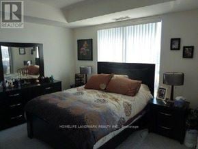 Toronto (Banbury-Don Mills) condo for rent - A bedroom with a bed, dresser, and mirror.