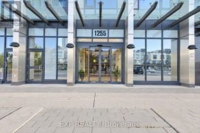 Pickering (Bay Ridges) condo for rent - The entrance to a building with glass doors and a sign that reads "1255".