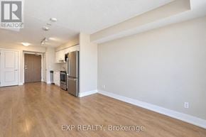 Pickering (Bay Ridges) condo for rent - A kitchen area with a refrigerator, microwave, and oven.