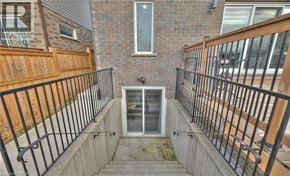 Niagara Falls apartment for rent - A small balcony with a metal railing and a glass door.