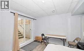 Niagara Falls apartment for rent - A room with a bed, a table and chairs, and a sliding glass door.