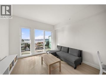 North Vancouver apartment for rent - A living room with a grey couch and a wooden coffee table.