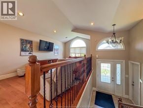 Windsor apartment for rent - A well-lit, spacious living room with a staircase leading to the upper level.