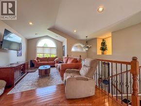 Windsor apartment for rent - A living room with a wooden floor and a staircase.