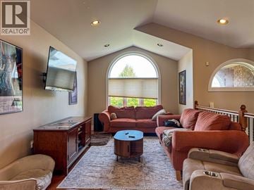 Windsor apartment for rent - A living room with a brown couch and a television.