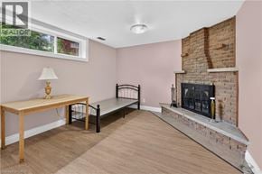 Kitchener apartment for rent - A living room with a fireplace and a bench.