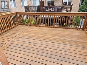Vaughan (East Woodbridge) townhouse for rent - A wooden deck with a railing and a balcony.