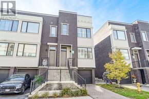 Vaughan (Vellore Village) townhouse for rent - A row of townhouses with a car parked in front of the first one.